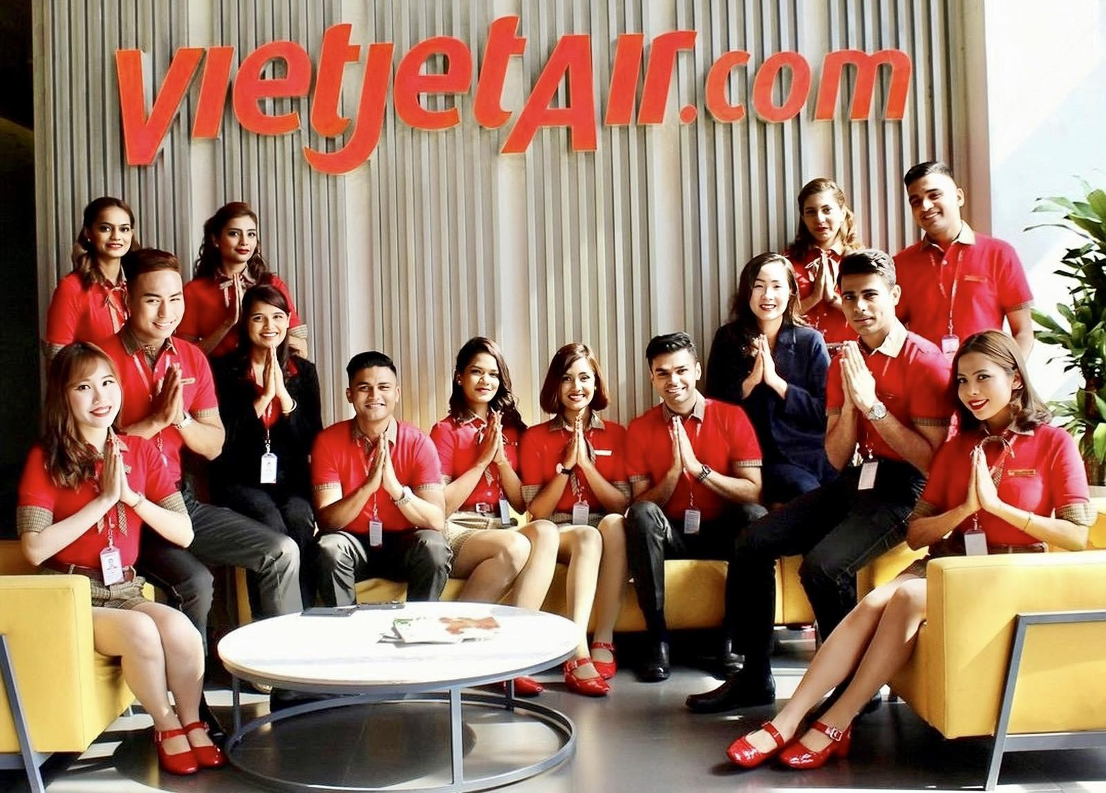 A group of people in red shirtsDescription automatically generated
