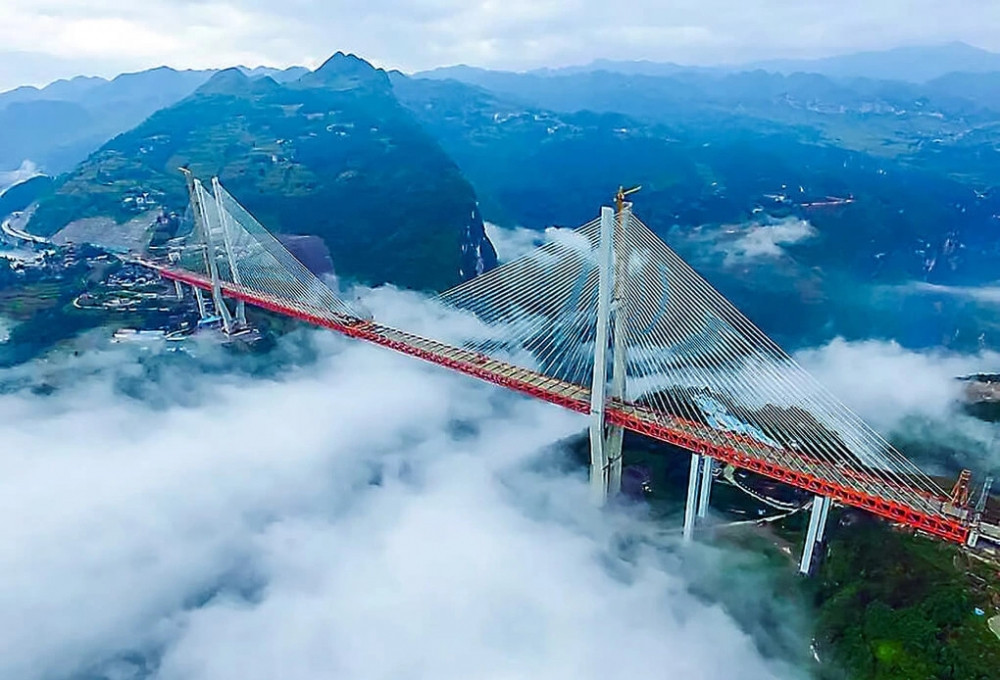 Tự phá kỷ lục của chính mình, láng giềng Việt Nam xây cầu cao nhất thế giới ẩn sâu trong hẻm núi, rút ngắn thời gian di chuyển từ 70 phút xuống còn 1