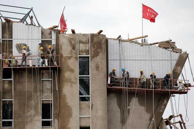 Công nhân đang bắt tay vào xây dựng một tòa nhà cao tầng ở trung tâm Bình Nhưỡng. Ảnh: Internet