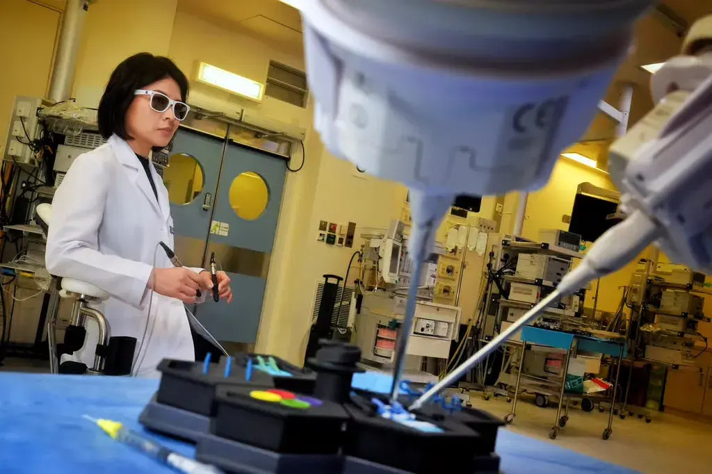 Dr Velda Chow operates the robotic microsurgical platform. Photo: Elson Li Dr Velda Chow operates the robotic microsurgical platform. Photo: Elson Li