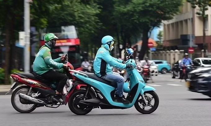 Grab, Be, Xanh SM được yêu cầu cung cấp thông tin đơn vị vận tải công nghệ. Ảnh minh họa. Hà Nội yêu cầu Be, Grab, Xanh SM cung cấp số lượng xe đang hoạt động - Ảnh 1.