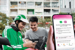 Người dùng Grab có thể chọn MoMo để thanh toán khi đặt xe