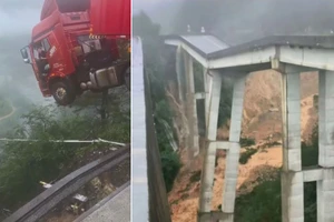 Trung Quốc: Mưa lũ gây sập cầu, tài xế container mắc kẹt trên miệng vực sâu 100m