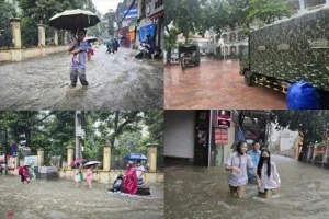 Thủ đô ngập lụt chưa từng có: Quân đội điều xe cứu trợ, phụ huynh bì bõm cõng con tan trường