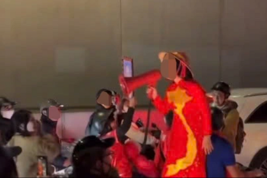 Xác minh video người phụ nữ cầm loa hô hào ‘Công an ngủ hết rồi, tí đi đua xe nhé’